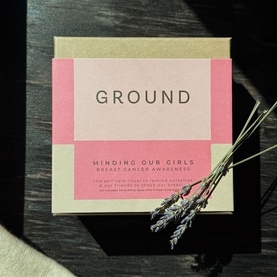 Ground Wellbeing Minding Our Girls Night Body Balm and Sleep Pillow Spray Duo Set in pink and kraft gift box, styled with dried lavender sprigs.