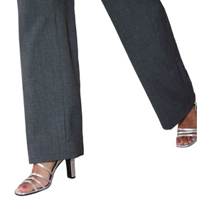Model wearing Whistles grey wide-leg tailored trousers with a vent hem, styled with silver strappy heeled mules.