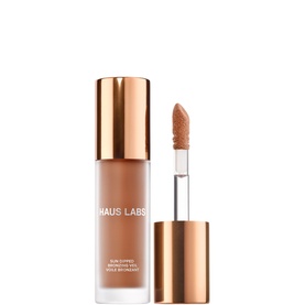 Haus Labs Sun Dipped Bronzing Veil in Veil Dune, liquid bronzer in gold-tone glass bottle with doe-foot applicator wand