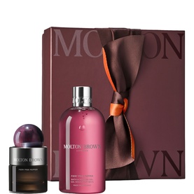 Molton Brown fragrance gift set with pink bath gel and dark glass eau de parfum, presented in a burgundy ribbon-tied gift box.