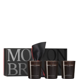 Molton Brown home fragrance candle gift set, three dark glass candles with black gift box and satin ribbon
