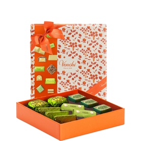 Venchi chocolate gift box with orange floral lid, filled with assorted pistachio and mixed chocolates in green and gold wrappers
