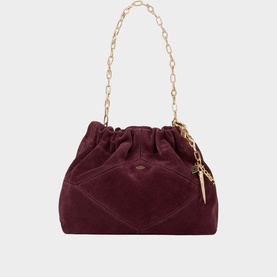 Bash burgundy suede slouch bag with gold chain handle and tassel charm detail