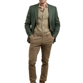 Model wearing Magee 1866 green blazer, styled with a beige shirt and tan chinos