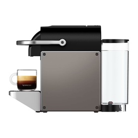 Krups Nespresso Pixie Titanium coffee machine in black, side profile view, shown with an espresso cup