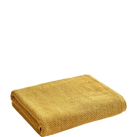Christys Bath Towel in Saffron, folded flat showing textured weave in warm mustard yellow cotton