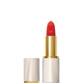 Victoria Beckham Beauty lipstick in House Red, open bullet showing vivid red shade, white marble-effect case with gold band