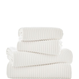 Deyongs white ribbed towels set of four, folded and stacked, featuring a textured ribbed design in bath and hand towel sizes