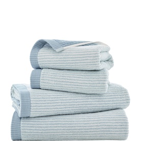 The Lyndon Company blue ribbed cotton towel set, stacked in five pieces showing varied sizes with stripe border detail