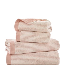 The Lyndon Company pink ribbed stripe towel set, four pieces stacked showing varied sizes with tonal two-colour texture