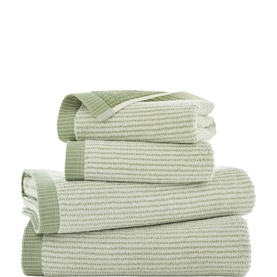 The Lyndon Company sage green ribbed cotton towel set, stack of four showing varied sizes with tonal stripe texture