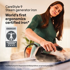 Model using Braun CareStyle 9 Steam Generator Iron 2700W in black, pressing fabric on an ironing board