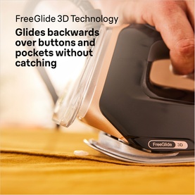 Braun CareStyle 9 Steam Generator Iron in black gliding over yellow fabric, demonstrating FreeGlide 3D Technology around buttons and pockets