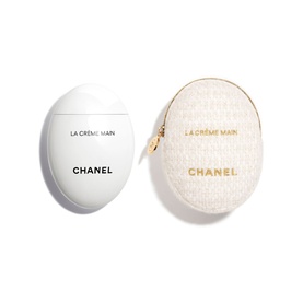 Chanel La Cr&egrave;me Main hand cream in white egg-shaped pot with matching cream and gold oval zip pouch set