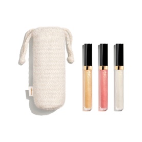 Chanel make-up set with three lip glosses in champagne, pink and clear shades, presented with a cream textured drawstring pouch