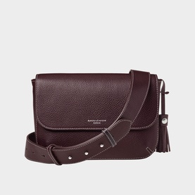 Aspinal of London dark burgundy pebbled leather crossbody bag, silver hardware, wide adjustable strap, tassel detail
