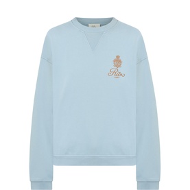 FRAME DENIM Emblem Logo Back Graphic Sweatshirt in light blue with crew neckline, gold emblem logo on chest, ribbed trims