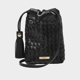 Aspinal of London black woven leather bucket bag with gold logo plaque, tassel detail, and slim crossbody strap