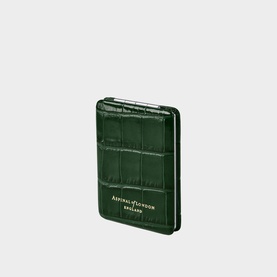 Aspinal of London green croc-embossed leather card holder with gold logo lettering and slim bifold design.