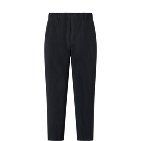 Issey Miyake black pleated trousers with elasticated waist, cropped tapered leg, 100% polyester
