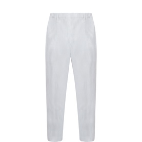 Issey Miyake light gray pleated trousers with elasticated waist, straight leg silhouette and textured ribbed fabric