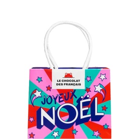 Le Chocolat Des Fran&ccedil;ais Joyeux No&euml;l multicoloured gift bag with bold typography, stars, and white rope handles