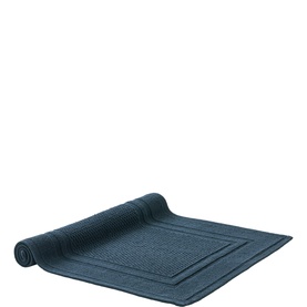 Christys Bath Towelling mat in navy, shown rolled at one end with a classic bordered panel design.