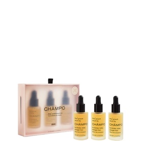 Champo Hair Care Set featuring three gold dropper bottles in a pink gift box