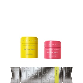 Trinny London The Everyday Essentials Skin Set featuring two face cream pots in yellow and pink with a silver gift cracker