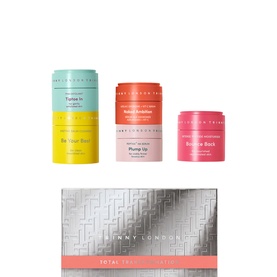 Trinny London The Total Transformation Skin Set, multi-coloured stackable pots in pink, coral and teal with silver gift box