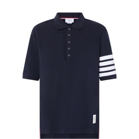 Thom Browne navy cotton polo shirt with signature white 4-bar stripe on left sleeve and logo patch, short sleeves