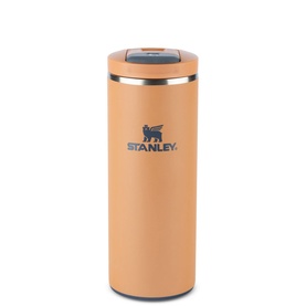 Stanley mug in Toast orange with gold-tone rim and lid, featuring embossed bear logo on front