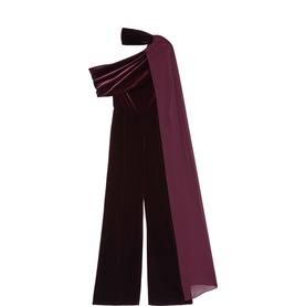 Reiss burgundy velvet wide-leg jumpsuit with one-shoulder bow detail and chiffon sash, ghost mannequin shot