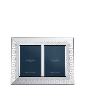 Waterford silver double picture frame with embossed diamond pattern border, holding two portrait-orientation photos side by side