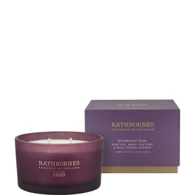 Rathbornes Seancha&iacute; D&uacute;n Scented Candle 390g in deep plum frosted glass vessel with four wicks, shown with purple gift box