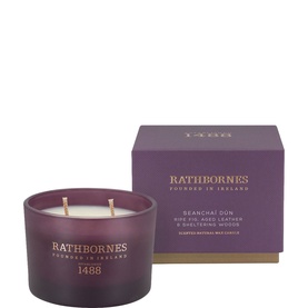 Rathbornes Seancha&iacute; D&uacute;n Scented Candle 190g in deep plum glass vessel with three wicks, shown with matching purple gift box.