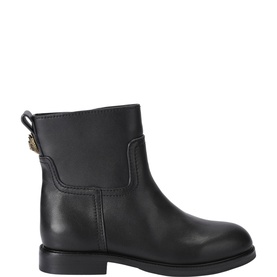 Kurt Geiger London black leather ankle boot with gold back hardware detail, flat rubber sole, side panelling, profile view.