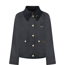 Barbour navy cotton jacket with dark corduroy collar, gold snap buttons, patch pockets, and small ring detail on chest.