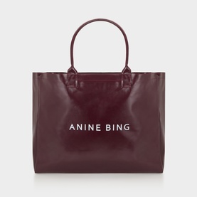 Anine Bing burgundy large tote bag with white logo lettering, dual top handles, and structured silhouette