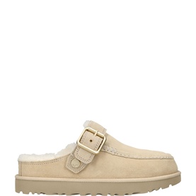UGG Australia white suede mule clog with shearling lining, gold-tone buckle strap, and ridged tan sole