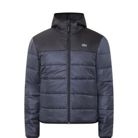 Lacoste men's casual puffer jacket in navy and black colourblock, hooded with zip fastening and crocodile logo badge