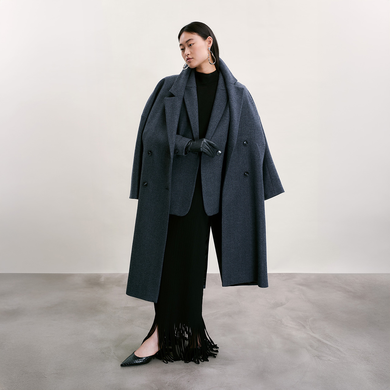 Model wearing long blazer and overcoat