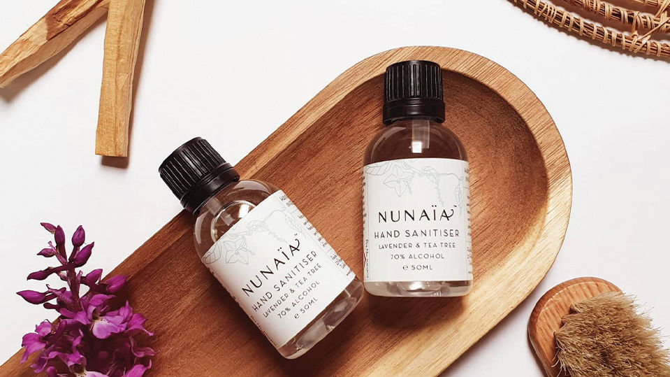 Nunaia hand sanitizer on wooden plate