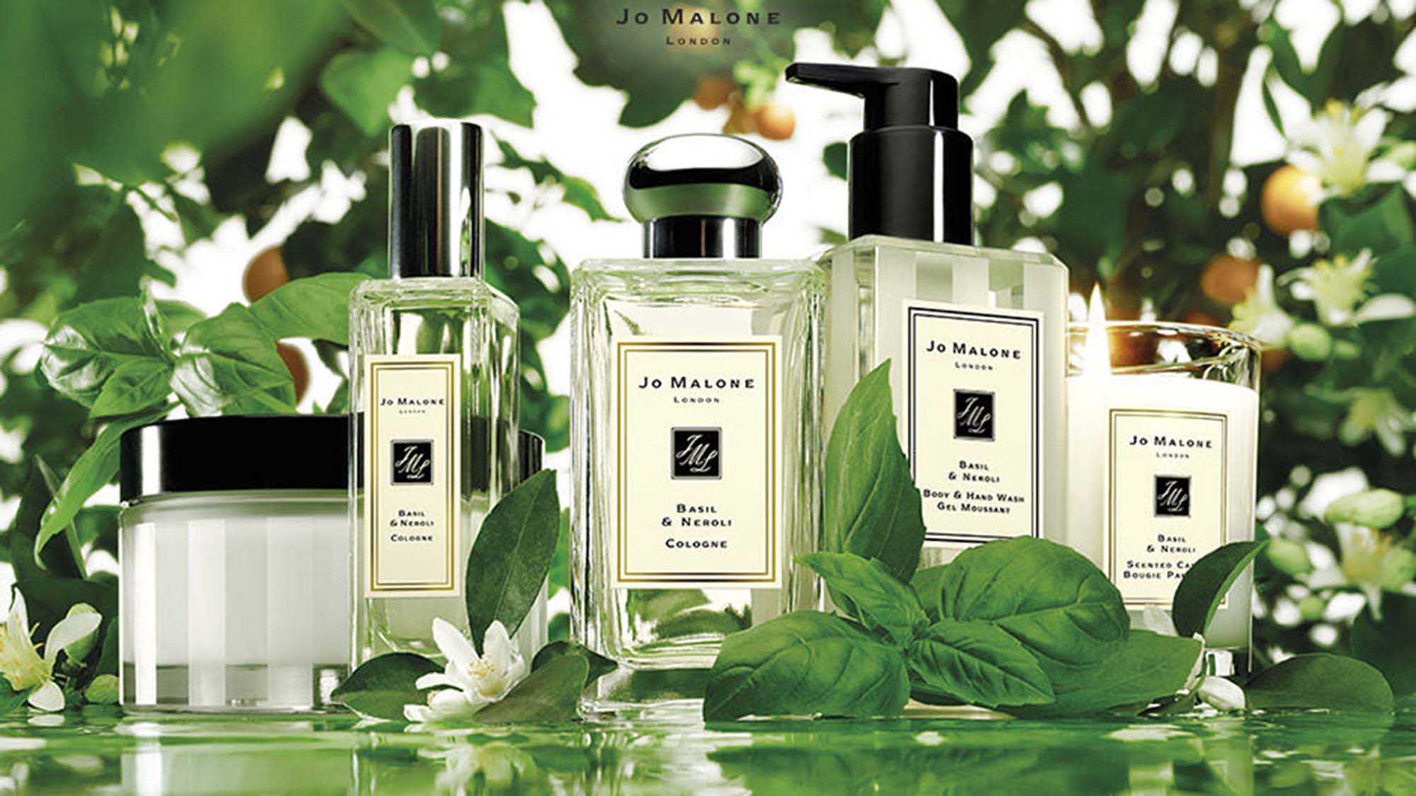 Jo Malone London Basil and Neroli product range with plant ingredients surrounding
