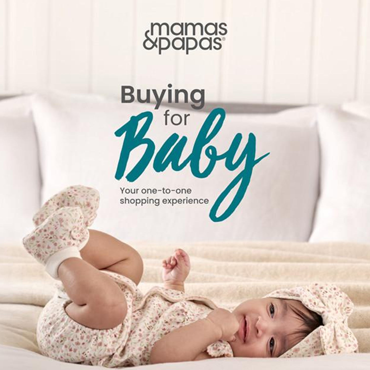 A baby lying on a blanket, with the text 'mamas & papas, Buying for Baby, Your one-to-one shopping experience' above.