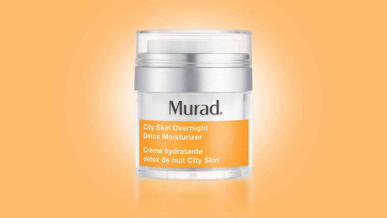 Murad City Skin Overnight Detox Moisturiser on orange background with white glow coming from behind the product