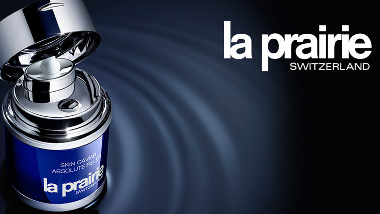 La Prairie skin cavier product on a dark surface with a ripple